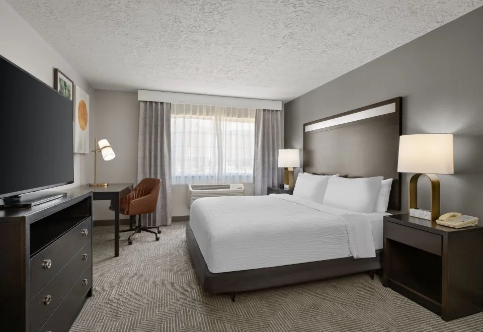 Guest bedroom at Holiday Inn and Suites Albuquerque Airport