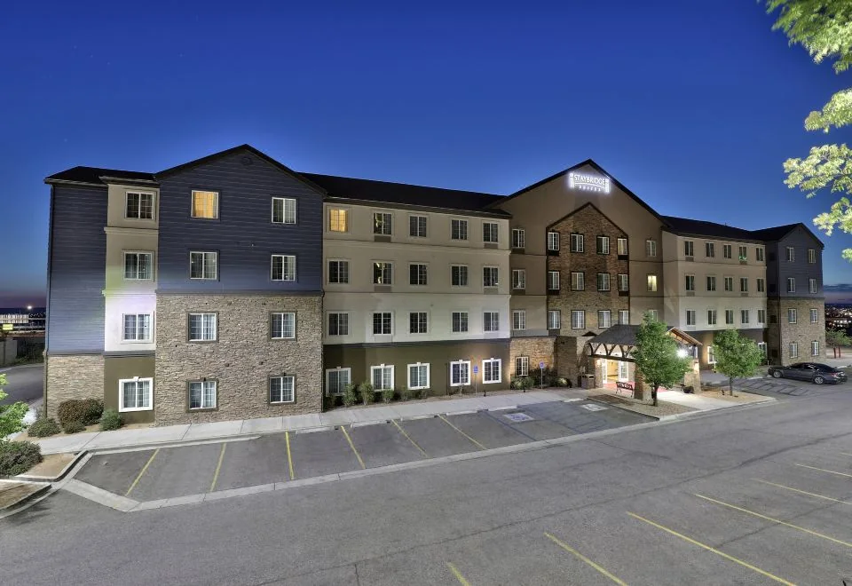 Staybridge Suites Albuquerque Airport building and entrance at dusk