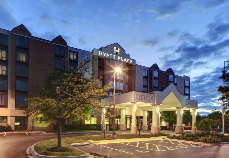 Hyatt Place Albuquerque Airport entrance and exterior at dusk